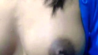 Squeezing Milk Out of Her Dark Nipples on Webcam
