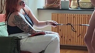 A Sex Slave in a Penis Cage Gets Whipped on the Balls and Sucks His Master's Cock.
