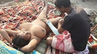 Desi housewife outdoor oil massage handjob with big tits and big nipples