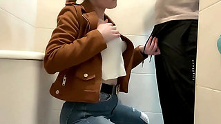 Busty Blonde Sucks Cock in the School Bathroom