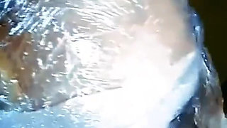 Skinny woman is wrapped in plastic and fucked in holes - Porn in Spanish