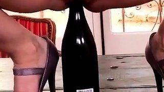 Big-Breasted Brunette Mature Plays with a Bottle