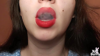 Big red lips smoking close up