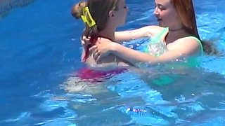 Lesbian Girls Are Having Fun in a Pool with an Inflatable Shark