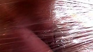 Plastic Wrapped Slut Gaping Wide Through Shiny Film
