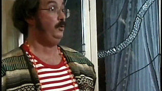 Ron Jeremy organizes orgy with a 70s crossdresser face fucking busty brunette on bed