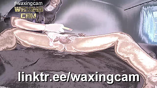 A Nurse in White Gloves Waxes a Guy