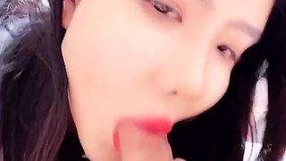 Petite Asian gives a blowjob in POV