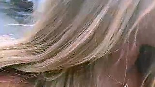 Blonde is flashing her big boobs in the outdoors