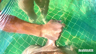 A Young Hottie Fucks with Her Boyfriend in the Pool Under Water