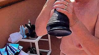 Fucked on the Terrace with a Giant Dildo
