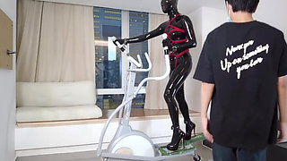 Mz27 - a Girl Bound in Latex Walks on a Treadmill